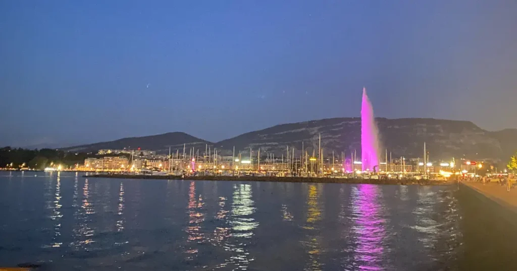 Apostilles and legalisation of international documents - Lake Geneva waterfront by night with illuminated Jet d'Eau fountain