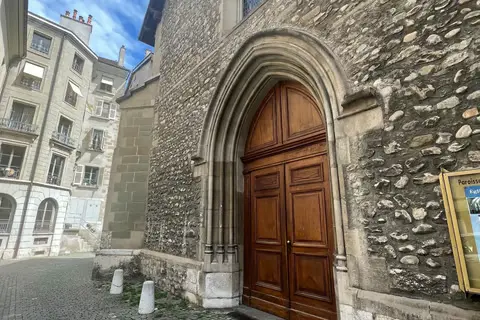 Saint-Germain Geneva historic church entrance with medieval Gothic stonework and traditional wooden doors